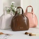 Schelpvormige cosmetische tas